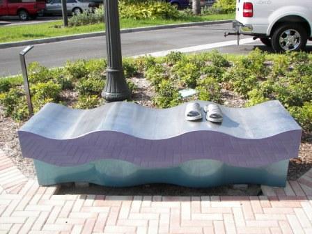 Indigo bench with wavy design and pair of shoes on bench